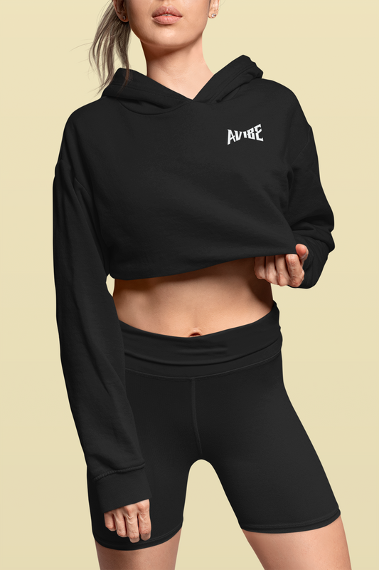 Person wearing a black hoodie and shorts set with 'AVENUE' branding on a beige background